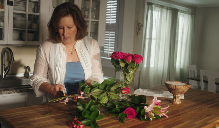 Woman making a flower arrangement