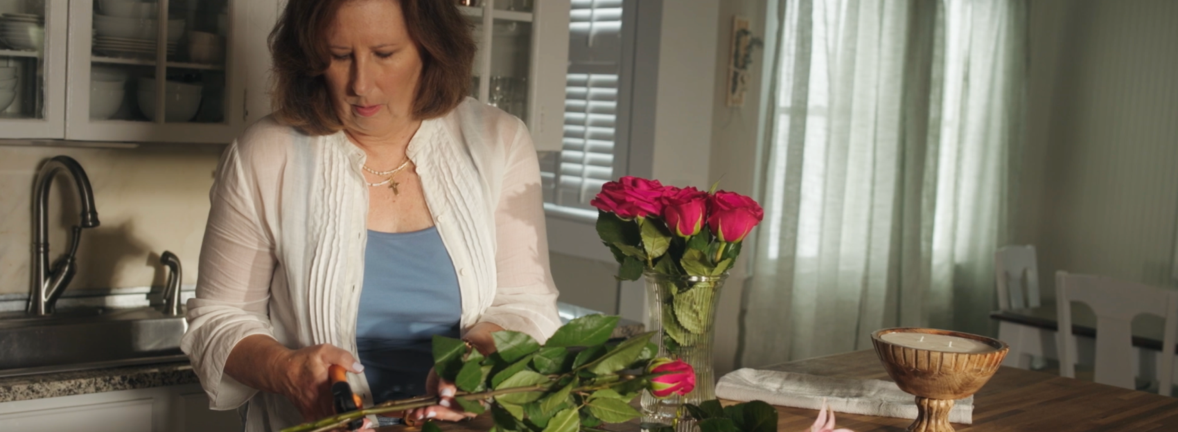 Woman making a flower arrangement 